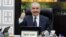 Palestinian Prime Minister Mohammad Shtayyeh gestures, as he convenes cabinet meeting, in Ramallah in the Israeli-occupied West Bank, Feb. 26, 2024.