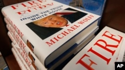 A stack of reserved "Fire and Fury" books by writer Michael Wolff sit on a shelf in a bookstore in Richmond, Va., Jan. 5, 2018. 