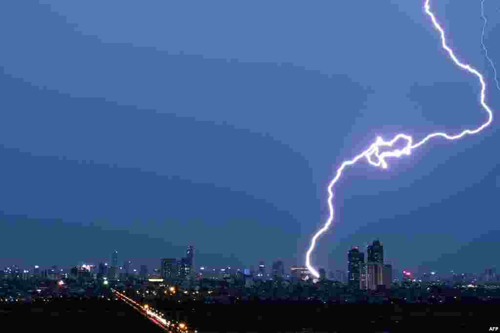 Lightning strikes over the Hanoi skyline, Vietnam.