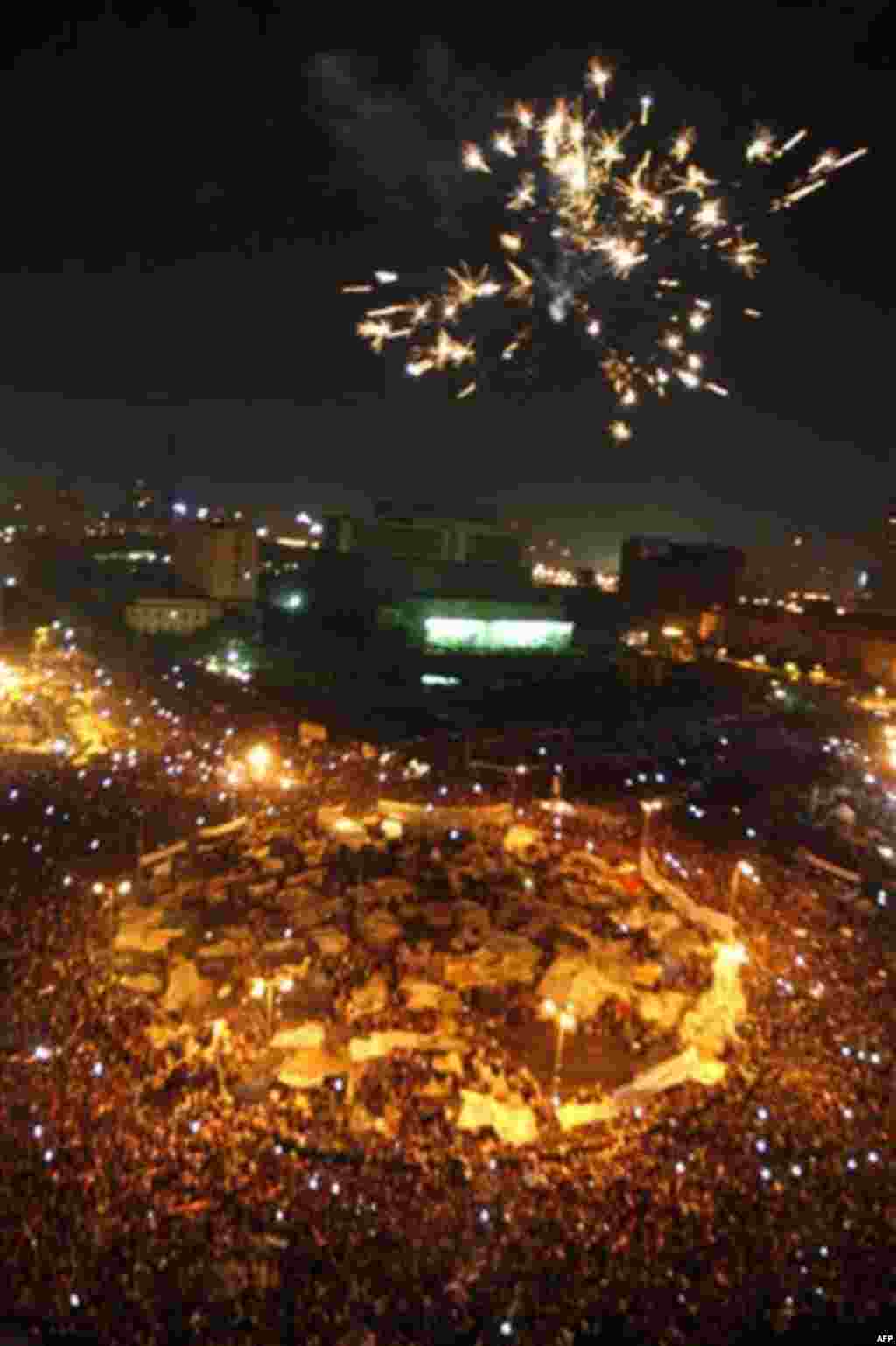 Egyptians set off fireworks as they celebrate after President Hosni Mubarak resigned and handed power to the military at Tahrir Square, in Cairo, Egypt, Friday, Feb. 11, 2011. Egypt exploded with joy, tears, and relief after pro-democracy protesters broug