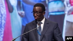 (FILES) Senegal Minister of Economy, Finance and Planning Amadou Ba speaks during a summit on human capital and investment in children for growth and productivity at the World Bank during the 2016 Annual Meetings of the International Monetary Fund Headqua