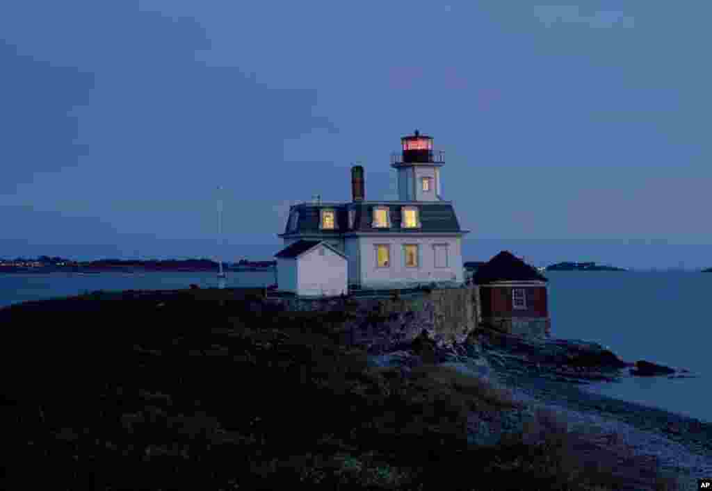 Rose Island Lighthouse in Newport, Rhode Island at dusk.