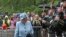 Queen Elizabeth II inspects the guard of honor before entering Balmoral Castle, Scotland, at the start of her annual holiday, Aug. 6, 2019.