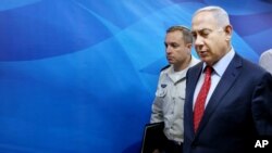 Israeli Prime Minister Benjamin Netanyahu arrives to chair the weekly cabinet meeting in Jerusalem, April 10, 2016. 