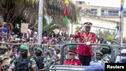 FILE - Gabon coup leader General Brice Nguema waves after being sworn in as interim president in Libreville, Gabon, on Sept. 4, 2023.