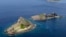 FILE - Part of a group of disputed islands, Minamikojima (bottom) and Kitakojima, known as Senkaku in Japan and Diaoyu in China, seen in the East China Sea, in this photo taken by Kyodo.
