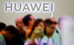 FILE - The Huawei logo is pictured at the IFA consumer tech fair in Berlin, Germany.