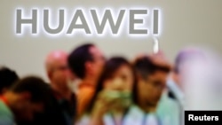 FILE - The Huawei logo is pictured at the IFA consumer tech fair in Berlin, Germany, Sept. 6, 2019. 