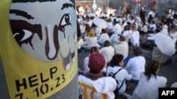 Relatives and supporters of Israelis held hostage in Gaza attend a sit-in demanding an immediate agreement for the return of all abductees in front of the Israeli Defense Ministry in Tel Aviv on Dec. 25, 2024, amid the ongoing war between Israel and the militant Hamas group.