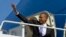 President Barack Obama boards Air Force One at Andrews Air Force Base, Maryland, Feb. 14, 2014, en route to Fresno, California, to discuss the ongoing drought. 