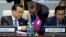 Chinese Premier Li Keqiang, left, talks with Foreign Minister Wang Yi, center, as he and Cambodia's Prime Minister Hun Sen, right, attend the opening session of the Asia-Europe Meeting (ASEM) summit in Ulaanbaatar, Mongolia July 15, 2016. 