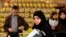 Syrian refugees shop after they receiving humanitarian aid shopping vouchers at a mall in Amman, April 11, 2013.