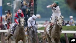 Irad Ortiz Jr., riding Creator, celebrates after winning the 148th running of the Belmont Stakes horse race in Elmont, N.Y., June 11, 2016.