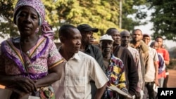 FILE - Voters queue outside a polling station in Bangui on Dec. 13, 2015, to vote for the constitutional referendum, seen as a test run for presidential and parliamentary polls.