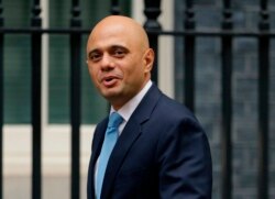 FILE - Government Cabinet Minister Sajid Javid arrives for a meeting at 10 Downing Street in London, Oct. 10, 2017.