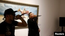 Hip-hop singers Battogtokh Odsaikhan (L) and Sanjjav Baatar of a band called Fish Symboled Stamp perform in an art gallery in Ulaanbaatar, Mongolia, June 23, 2017.