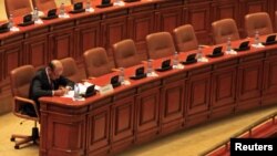 Romania's President Traian Basescu sits inside the Parliament before the vote on his suspension, Bucharest. July 6, 2012.