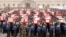 In this handout photo provided by the Defense Ministry, Yemeni officers and soldiers carry coffins of soldiers who were killed in a suicide bomb attack at a parade square during their funeral procession in Sanaa, Yemen, Thursday, May 24, 2012. A Yemeni so