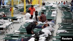 Migrants from Central America rest inside the "House of the Refugee", which gives temporary shelter to migrants released by ICE and CBP due to overcrowded facilities, in El Paso, Texas, U.S. April 24, 2019. 