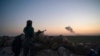 FILE - Smoke rises after an airstrike hit territory held by Islamic State militants in a desert in Syria, Feb. 19, 2019. U.S. strikes in late October 2024 have hit Islamic State group camps in Syria, killing up to 35 militants, the U.S. reports.