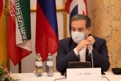 Iran's top nuclear negotiator Araqchi and EEAS Schmid attend a meeting in Vienna, Sep. 1, 2020.