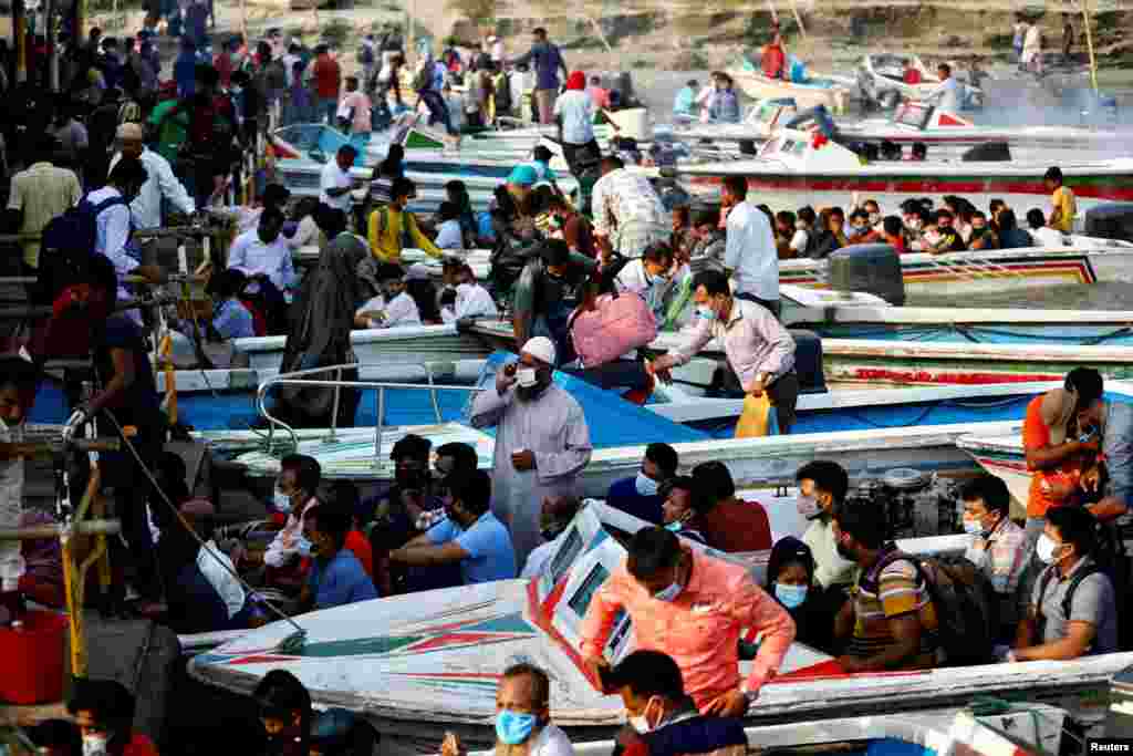 Migrant people and workers leave the city in speedboats before the countrywide lockdown imposed as COVID-19 cases increased, at Mawa ferry port in Munshiganj, Bangladesh, April 13, 2021.