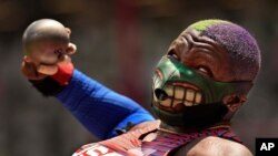 Raven Saunders of the United States competes in the final of the women's shot put at the 2020 Summer Olympics, Aug. 1, 2021, in Tokyo, Japan.