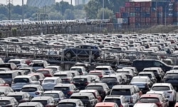 FILE - In this Wednesday, June 3, 2020 filer photo, new cars are stored at the 'logport' (logistic port) in Duisburg, Germany. German industrial production plunged by nearly 18% in April compared with the previous month at the height of Europe's…