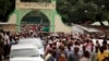 FILE - Muslims faithfuls carry a coffin with the body of Sheikh Mohammed Idris, chairman of the Council of Imams and Preachers of Kenya (CIPK), who was gunned down by assailants, during his funeral at the coastal port town of Mombasa, June 10, 2014.