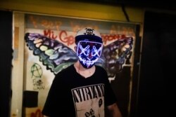 A protester wears a colorful mask during a Black Lives Matter protest at the Mark O. Hatfield United States Courthouse July 30, 2020, in Portland, Ore.