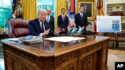 President Donald Trump speaks in the Oval Office of the White House, Thursday, May 28, 2020, in Washington.