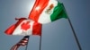 FILE - National flags representing the United States, Canada and Mexico fly in the breeze in New Orleans on April 21, 2008. 