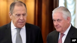 U.S. Secretary of State Rex Tillerson, right, and Russian Foreign Minister Sergey Lavrov, enter a hall prior to their talks in Moscow, Russia, April 12, 2017.