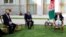 FILE - Afghan President Ashraf Ghani, right, and fellow leader Abdullah Abdullah, center, meet with U.S. peace envoy Zalmay Khalilzad at the Presidential Palace, in Kabul, May 20, 2020.