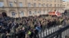 Protesters gather outside the parliament building of the Georgian separatist region of Abkhazia as tensions flared over a proposed measure that would allow Russians to buy property in the region, in Sukhumi, Georgia, on Nov. 15, 2024. (AIASHARA Independent Agency via AP)