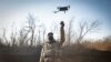 Ukrainian serviceman flies a drone during an operation against Russian positions at an undisclosed location in the Donetsk region, Ukraine, Dec. 4, 2022.
