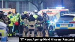 Emergency personnel and police officers work at the adult education center Campus Risbergska school after a shooting attack in Orebro, Sweden, Feb. 4, 2025. 