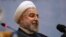 FILE - Iranian President Hassan Rouhani sits while attending the 27th International Islamic Unity Conference in Tehran, Iran, Friday, Jan. 17, 2014.