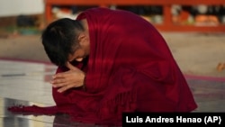 Daniel Choi meditates at the New Jersey Buddhist Vihara and Meditation Center in Franklin Township, N.J. on Tuesday, Nov. 12, 2024. (AP photo/Luis Andres Henao)