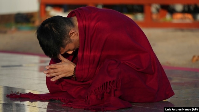 Daniel Choi meditates at the New Jersey Buddhist Vihara and Meditation Center in Franklin Township, N.J. on Tuesday, Nov. 12, 2024. (AP photo/Luis Andres Henao)