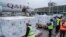 Officials receive boxes of Moderna coronavirus vaccine at the airport in Nairobi, Kenya, Sept. 6, 2021. 