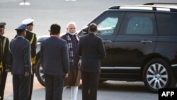 FILE - Indian Prime Minister Narendra Modi (2-R) arrives to attend a military ceremony as part of Republic Day celebrations, in New Delhi, India, Jan. 29, 2020.