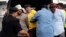 2011 FILE: Police detain opposition Parti Keadilan Rakyat (PKR) MP Tian Chua (3rd L in yellow) and supporters of the "Bersih" (Clean) electoral reform coalition during a rally in Kuala Lumpur, Malaysia.