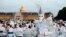 Participants dressed in white take part in the White Dinner, at the Invalides gardens, in Paris, Sunday, June 3, 2018.