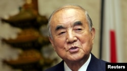 FILE - Former Japanese Prime Minister Yasuhiro Nakasone is interviewed at his office in Tokyo, Nov. 22, 2005.