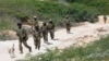 FILE - African Union soldiers, patrol in the Marka district 90 kilometers from the Somali capital, Mogadishu, July 17, 2016.