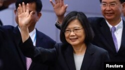 Taiwan's President Tsai Ing-wen waves near the boarding gate on the day of her departure to New York to start her trip to Guatemala and Belize, in Taoyuan, Taiwan March 29, 2023.