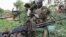 Ugandan soldiers serving with African Union Mission in Somalia take a break during patrols in Lafole village, near Afgoye district in Mogadishu, May 27, 2012. 