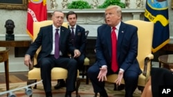 President Donald Trump meets with Turkish President Recep Tayyip Erdogan in the Oval Office of the White House, Nov. 13, 2019, in Washington. 