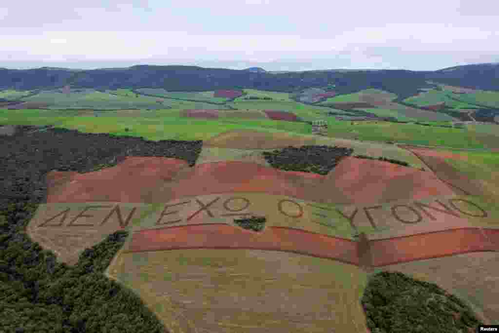 A drone view shows a message plowed across fields reading &quot;I have no oxygen&quot;, a phrase a victim of a deadly train accident in 2023 that killed 57 passengers, used in a phone call to the emergency services, in the village of Galarinos, Greece.&nbsp;